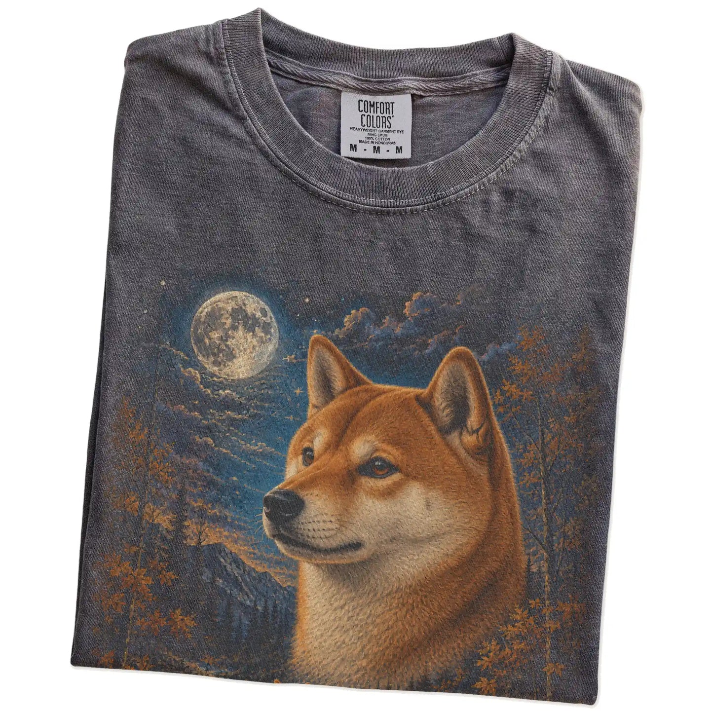 Folded Pepper Comfort Colors® t-shirt showing Shiba Inu in a fall forest graphic