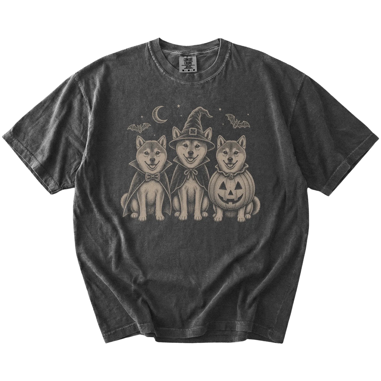 Three Shiba Inu dogs dressed for Halloween beneath bats and a crescent moon on a Pepper Comfort Colors® T-shirt