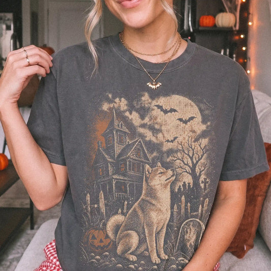 Model wearing a Pepper Comfort Colors® T-shirt showing Shiba Inu in a vintage haunted-house scene