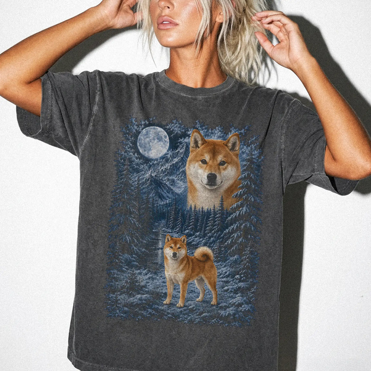 Model wearing a pepper T-shirt with Shiba Inu Winter Moon artwork.