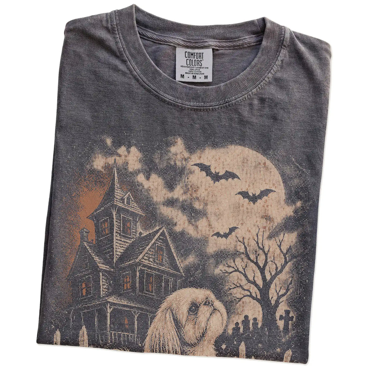 Folded Pepper Comfort Colors® T-shirt showing Shih Tzu in a vintage haunted-house scene