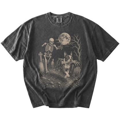 Boston Terrier running from a skeleton on a Pepper Comfort Colors® T-shirt