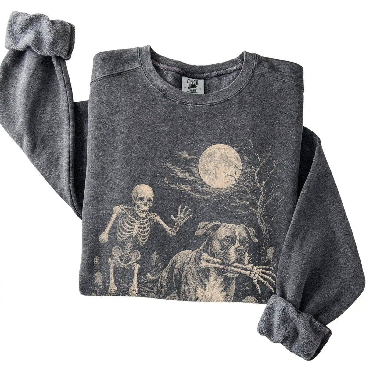 Folded pepper sweatshirt with a Boxer carrying a skeleton arm through a graveyard.