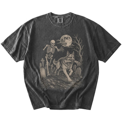 German Shepherd running from a skeleton on a Pepper Comfort Colors® T-shirt