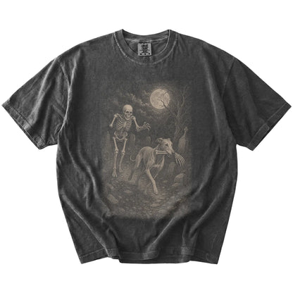 Greyhound running from a skeleton on a Pepper Comfort Colors® T-shirt