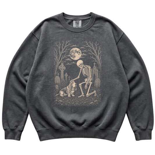 Skeleton petting a Basset Hound in a graveyard on a Pepper sweatshirt