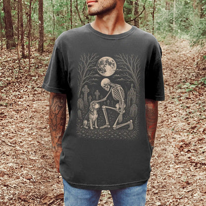 Model wearing a Pepper Comfort Colors® T-shirt showing Beagle sharing a quiet cemetery moment with a friendly skeleton