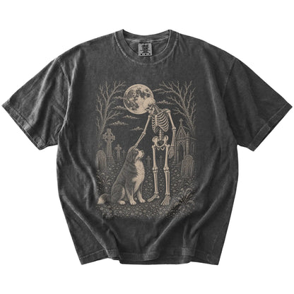 Bernese Mountain Dog sharing a quiet cemetery moment with a friendly skeleton on a Pepper Comfort Colors® T-shirt