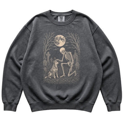 Skeleton petting a Blue Heeler in a graveyard on a Pepper sweatshirt