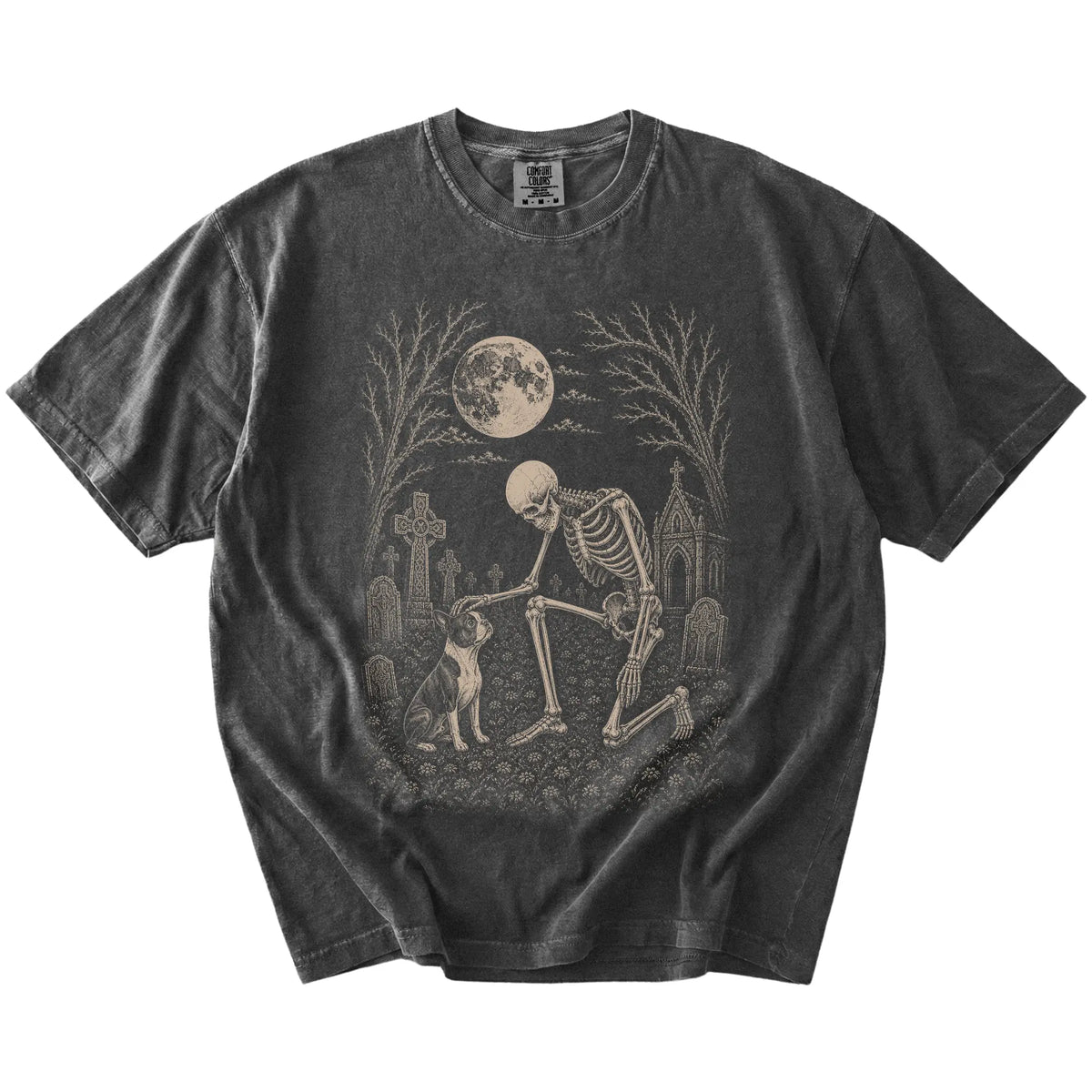 Boston Terrier sharing a quiet cemetery moment with a friendly skeleton on a Pepper Comfort Colors® T-shirt