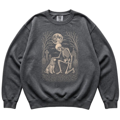 Skeleton petting a Cocker Spaniel in a graveyard on a Pepper sweatshirt