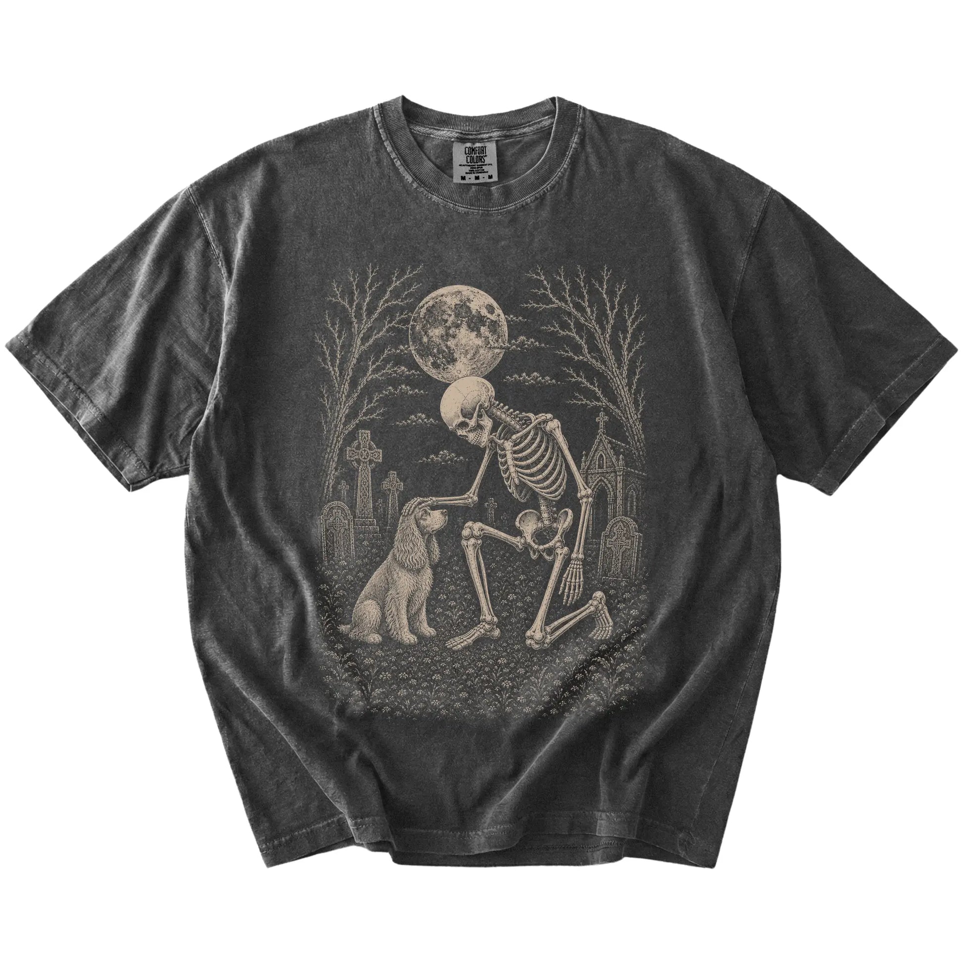 Cocker Spaniel sharing a quiet cemetery moment with a friendly skeleton on a Pepper Comfort Colors® T-shirt