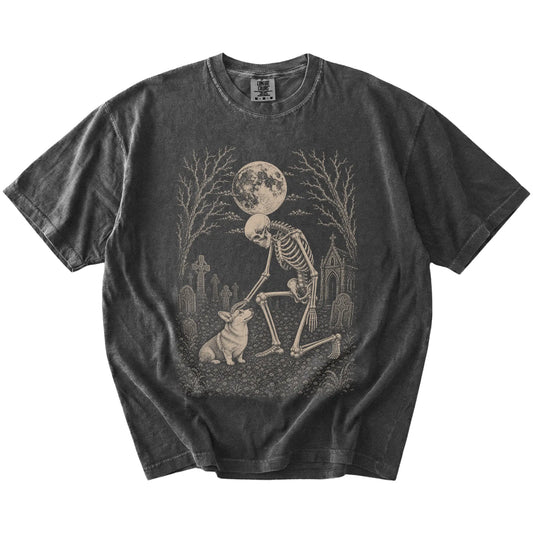 Corgi sharing a quiet cemetery moment with a friendly skeleton on a Pepper Comfort Colors® T-shirt