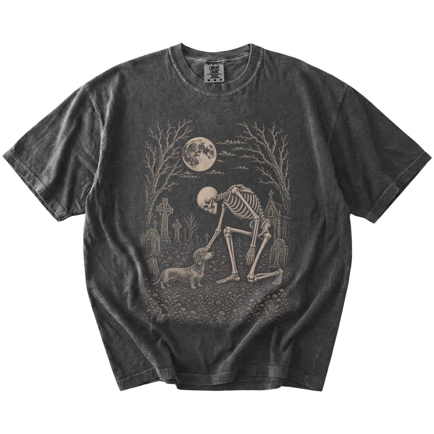 Dachshund sharing a quiet cemetery moment with a friendly skeleton on a Pepper Comfort Colors® T-shirt