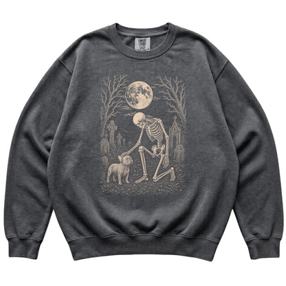 Skeleton petting a French Bulldog in a graveyard on a Pepper sweatshirt