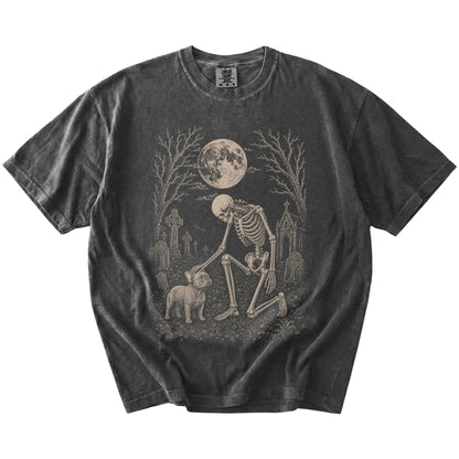 French Bulldog sharing a quiet cemetery moment with a friendly skeleton on a Pepper Comfort Colors® T-shirt