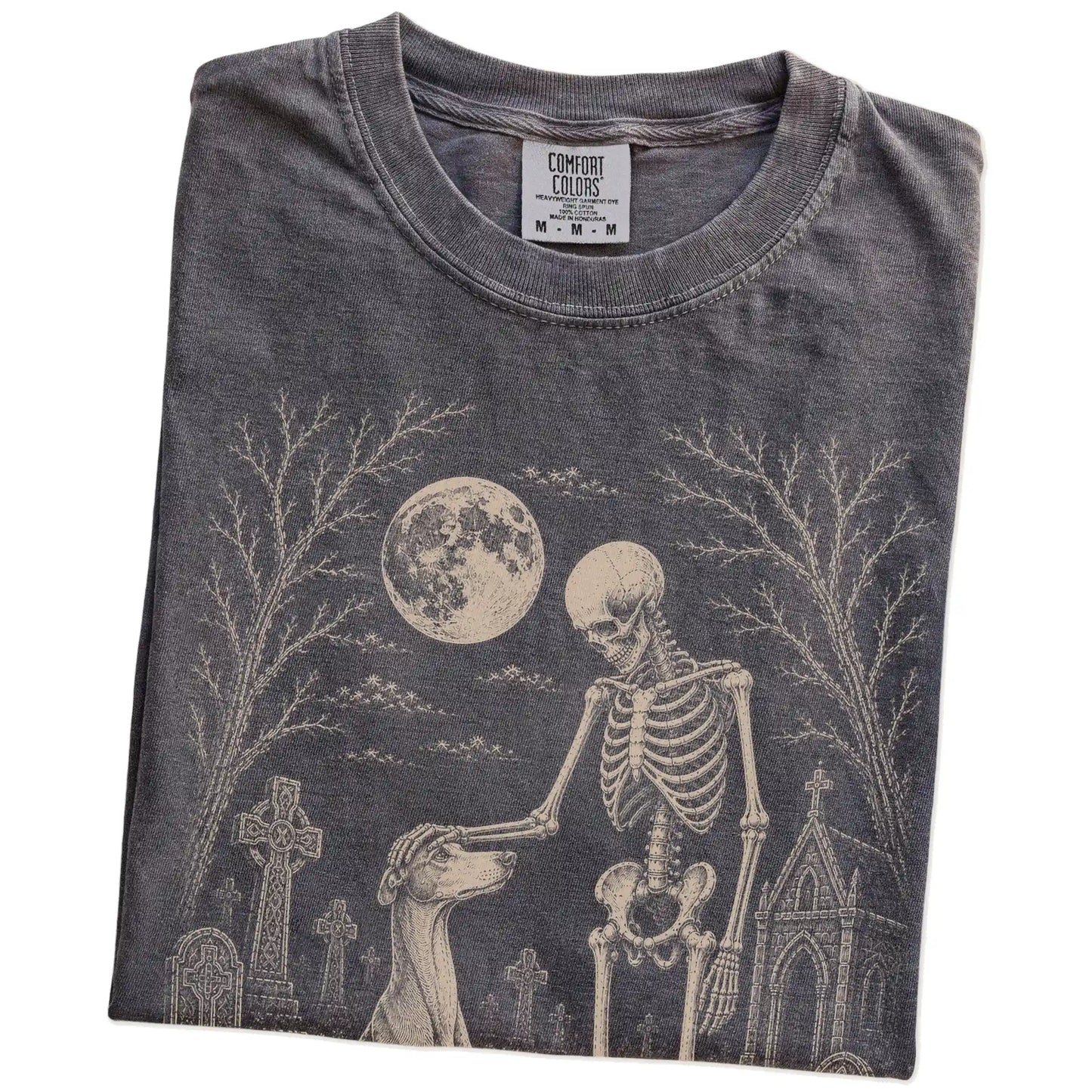 Folded Pepper Comfort Colors® T-shirt showing Greyhound sharing a quiet cemetery moment with a friendly skeleton