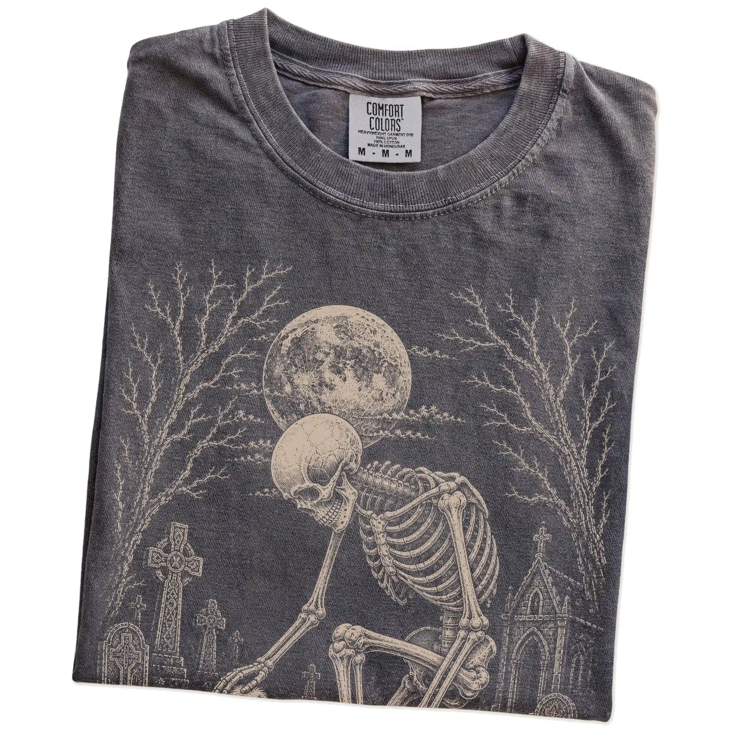 Folded Pepper Comfort Colors® T-shirt showing Havanese sharing a quiet cemetery moment with a friendly skeleton