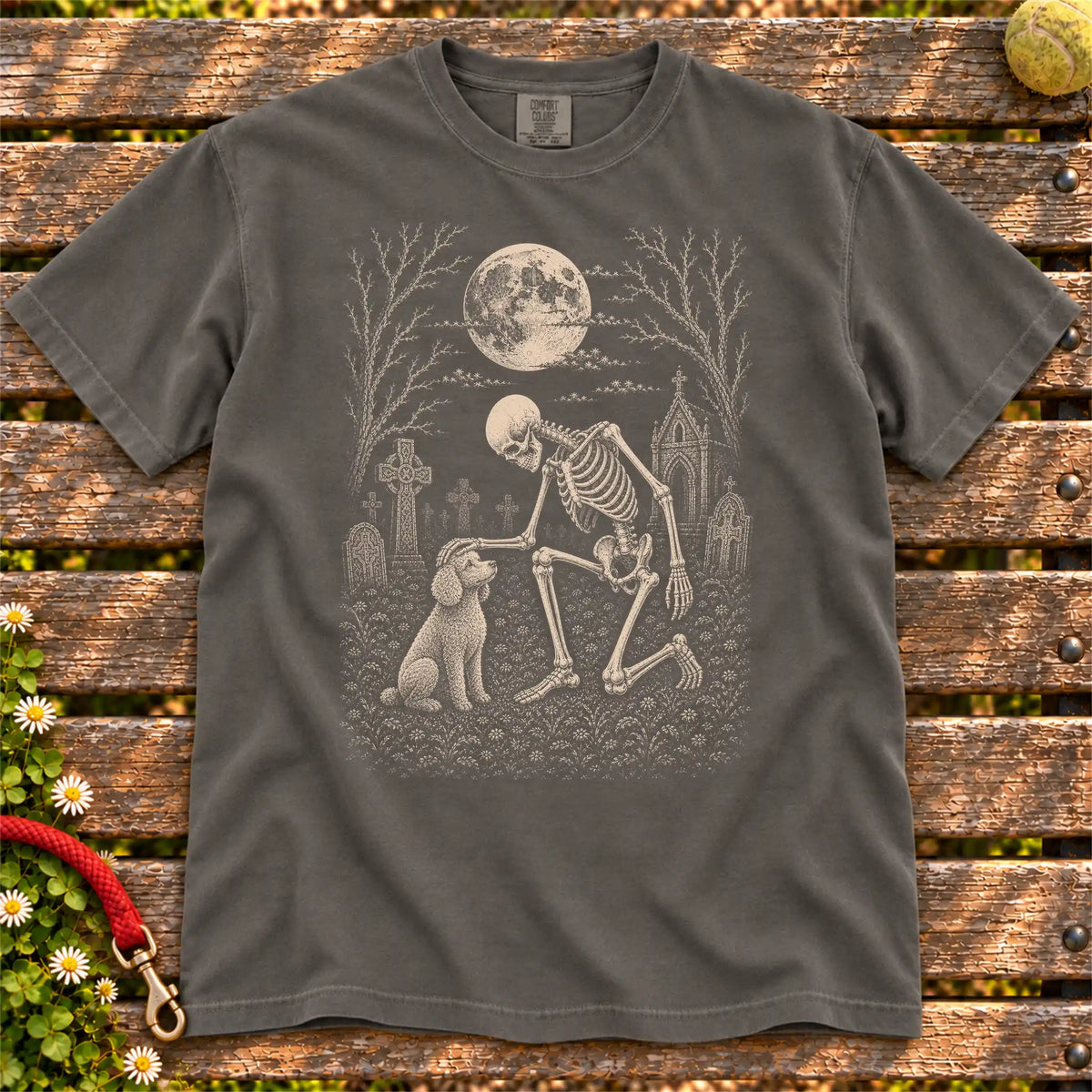 Poodle sharing a quiet cemetery moment with a friendly skeleton on a Pepper Comfort Colors® T-shirt