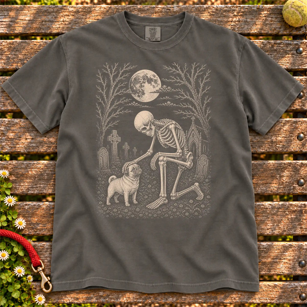 Pug sharing a quiet cemetery moment with a friendly skeleton on a Pepper Comfort Colors® T-shirt