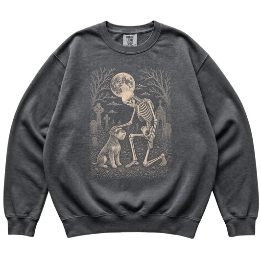 Skeleton petting a Schnauzer in a graveyard on a Pepper sweatshirt