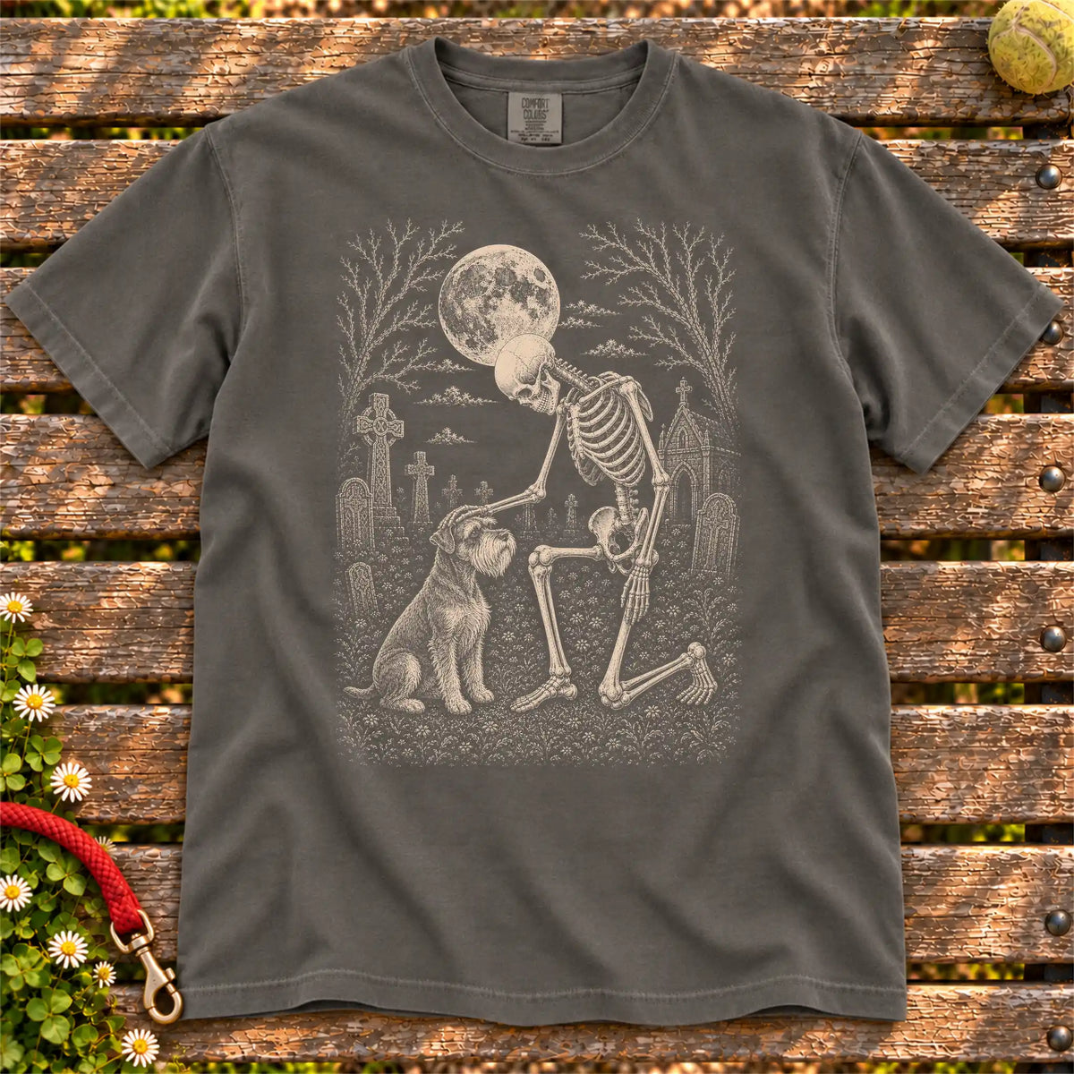 Schnauzer sharing a quiet cemetery moment with a friendly skeleton on a Pepper Comfort Colors® T-shirt
