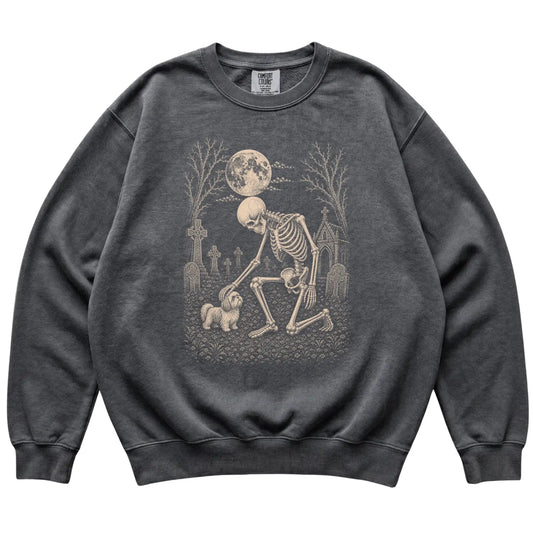 Skeleton petting a Shih Tzu in a graveyard on a Pepper sweatshirt