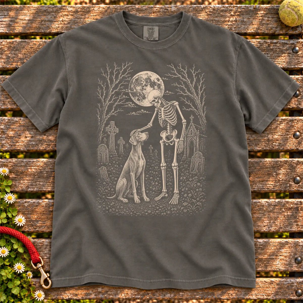 Weimaraner sharing a quiet cemetery moment with a friendly skeleton on a Pepper Comfort Colors® T-shirt