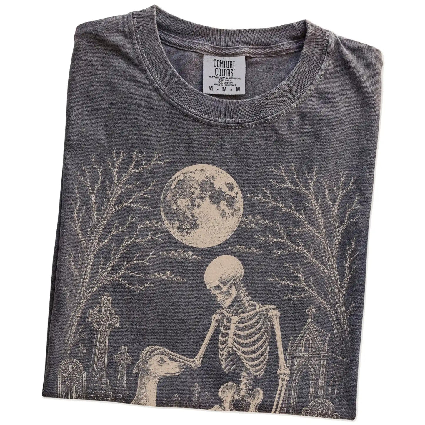 Folded Pepper Comfort Colors® T-shirt showing Whippet sharing a quiet cemetery moment with a friendly skeleton