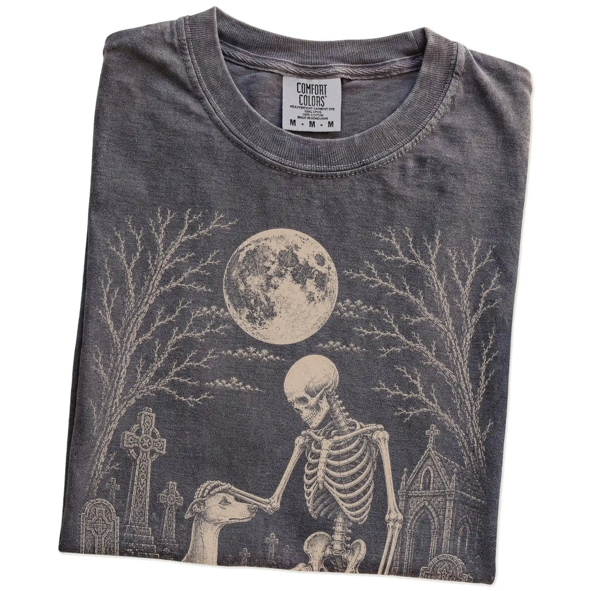 Folded Pepper Comfort Colors® T-shirt showing Whippet sharing a quiet cemetery moment with a friendly skeleton