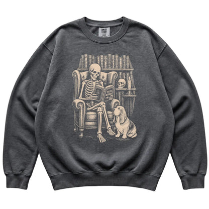 Skeleton reading Tales Beyond to a Basset Hound on a Pepper sweatshirt