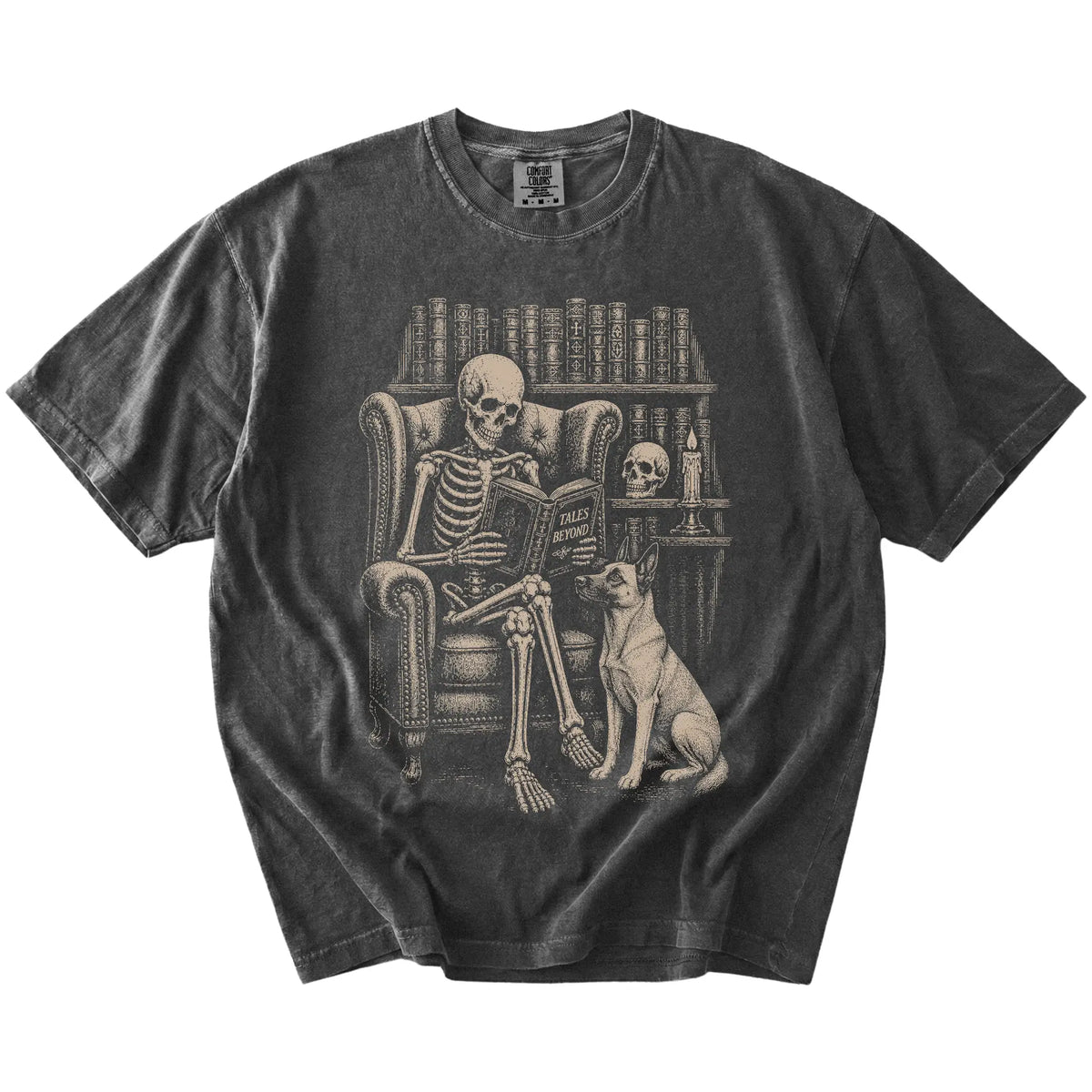 Skeleton reading in a library beside a Belgian Malinois on a Pepper Comfort Colors® T-shirt