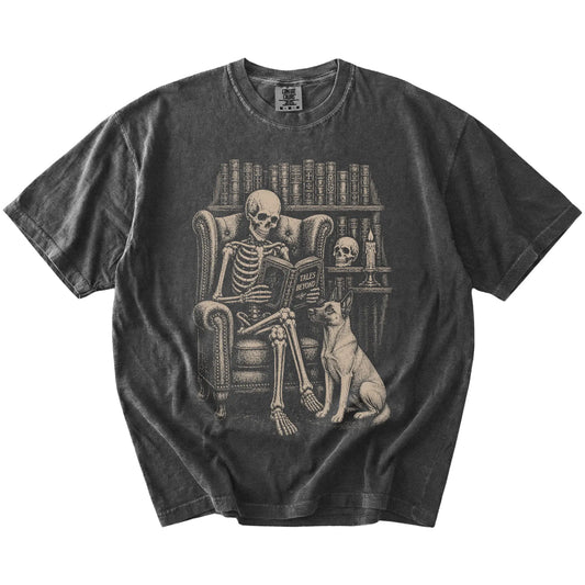 Skeleton reading in a library beside a Belgian Malinois on a Pepper Comfort Colors® T-shirt