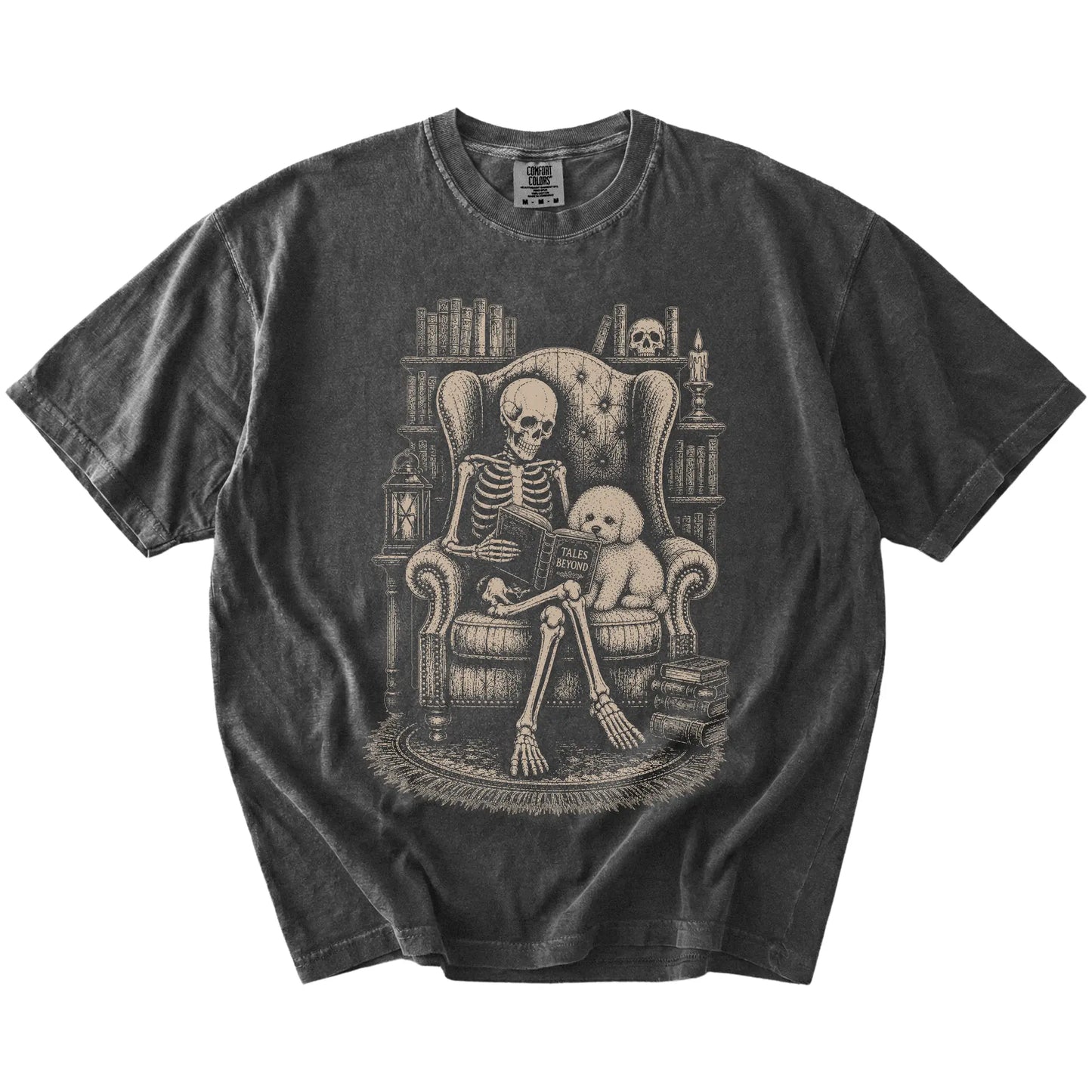 Skeleton reading in a library beside a Bichon Frise on a Pepper Comfort Colors® T-shirt