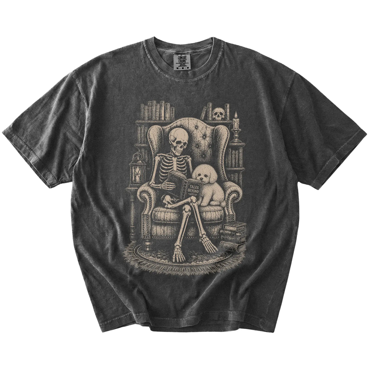Skeleton reading in a library beside a Bichon Frise on a Pepper Comfort Colors® T-shirt