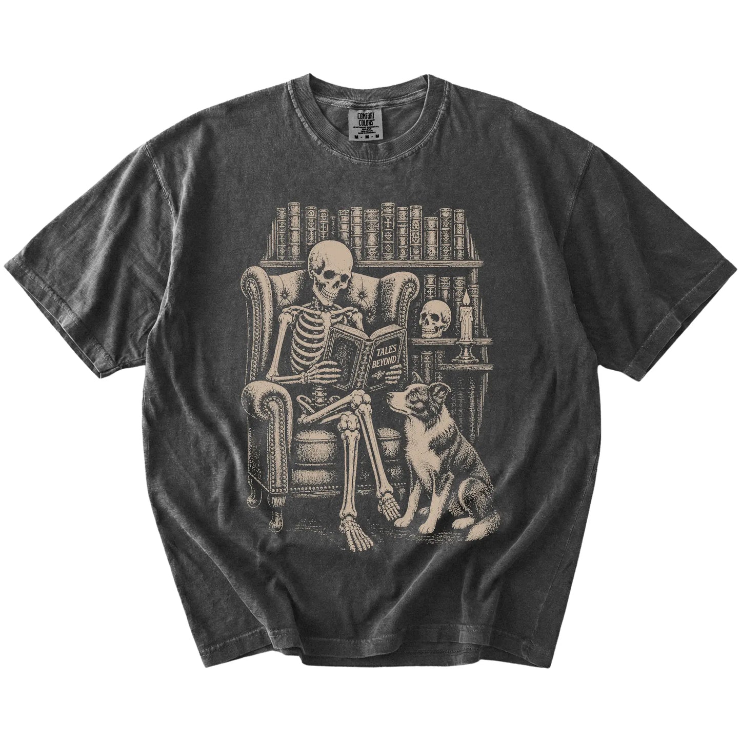 Skeleton reading in a library beside a Border Collie on a Pepper Comfort Colors® T-shirt