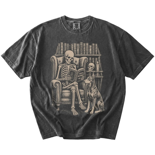 Skeleton reading in a library beside a Doberman on a Pepper Comfort Colors® T-shirt