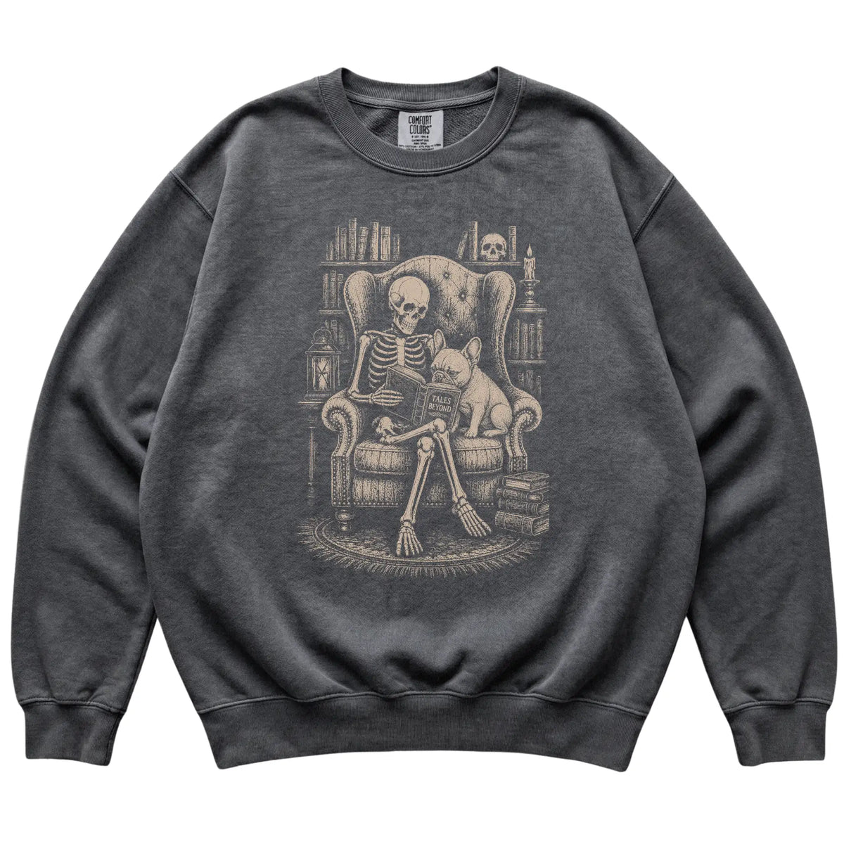 Skeleton reading Tales Beyond to a French Bulldog on a Pepper sweatshirt