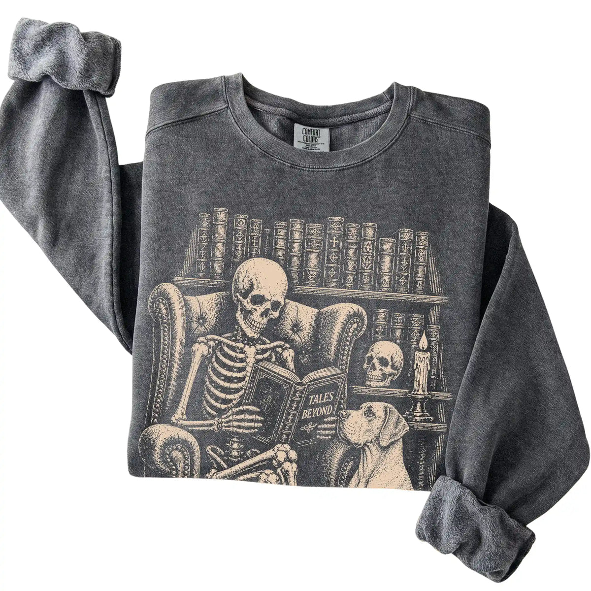 Folded Pepper sweatshirt with a skeleton reading Tales Beyond to a Great Dane