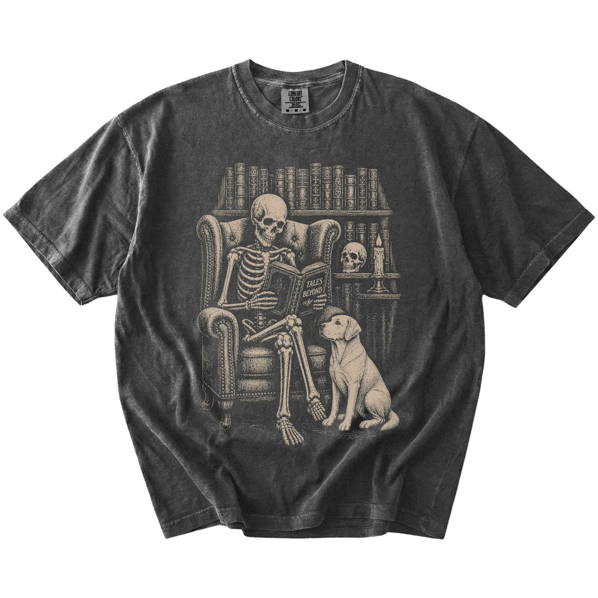 Skeleton reading in a library beside a Labrador Retriever on a Pepper Comfort Colors® T-shirt
