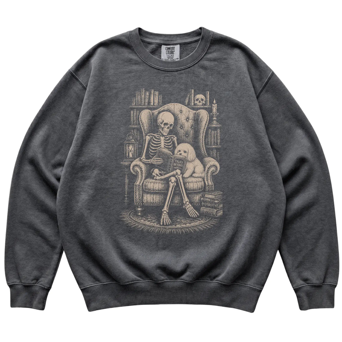 Skeleton reading Tales Beyond to a Maltese on a Pepper sweatshirt