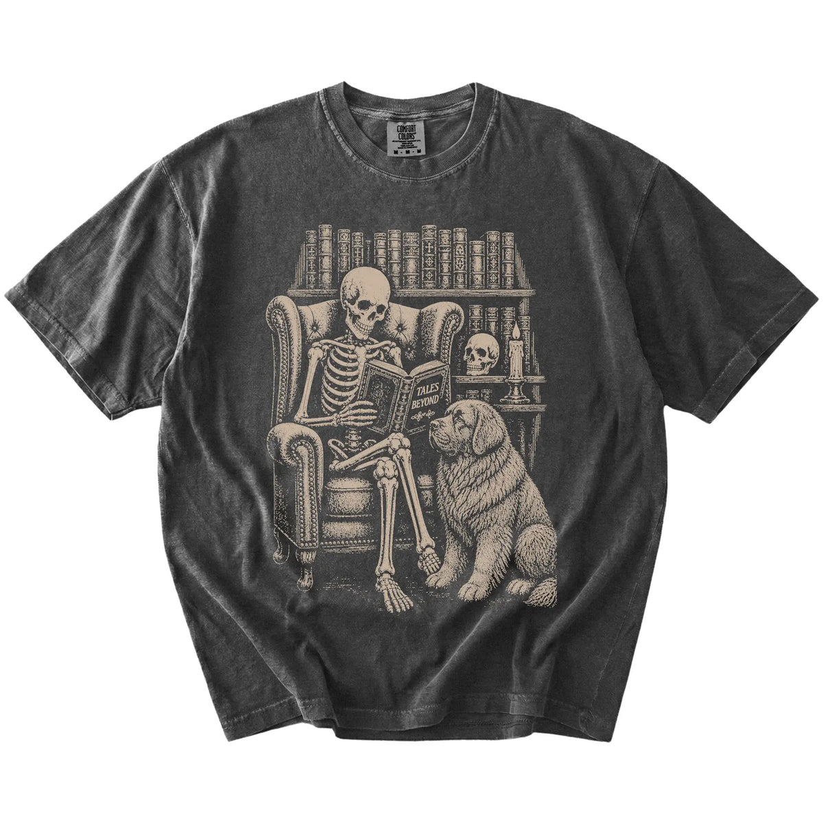 Skeleton reading in a library beside a Newfie on a Pepper Comfort Colors® T-shirt
