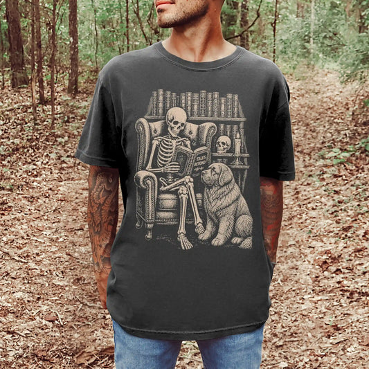 Model wearing a Pepper Comfort Colors® T-shirt showing skeleton reading in a library beside a Newfie
