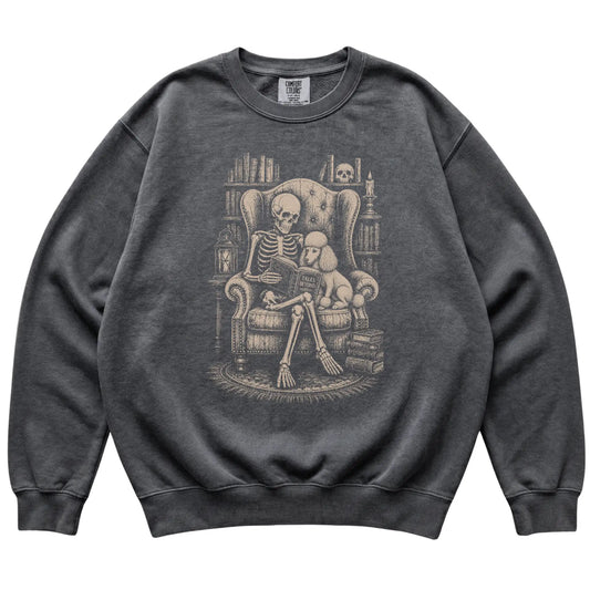 Skeleton reading Tales Beyond to a Poodle on a Pepper sweatshirt