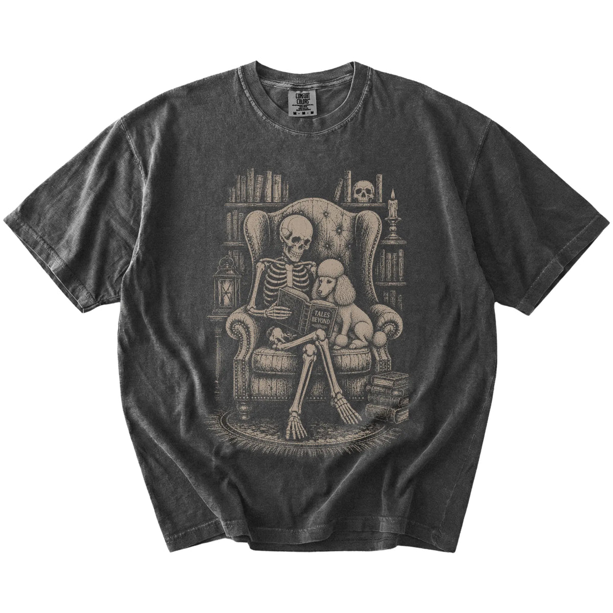 Skeleton reading in a library beside a Poodle on a Pepper Comfort Colors® T-shirt