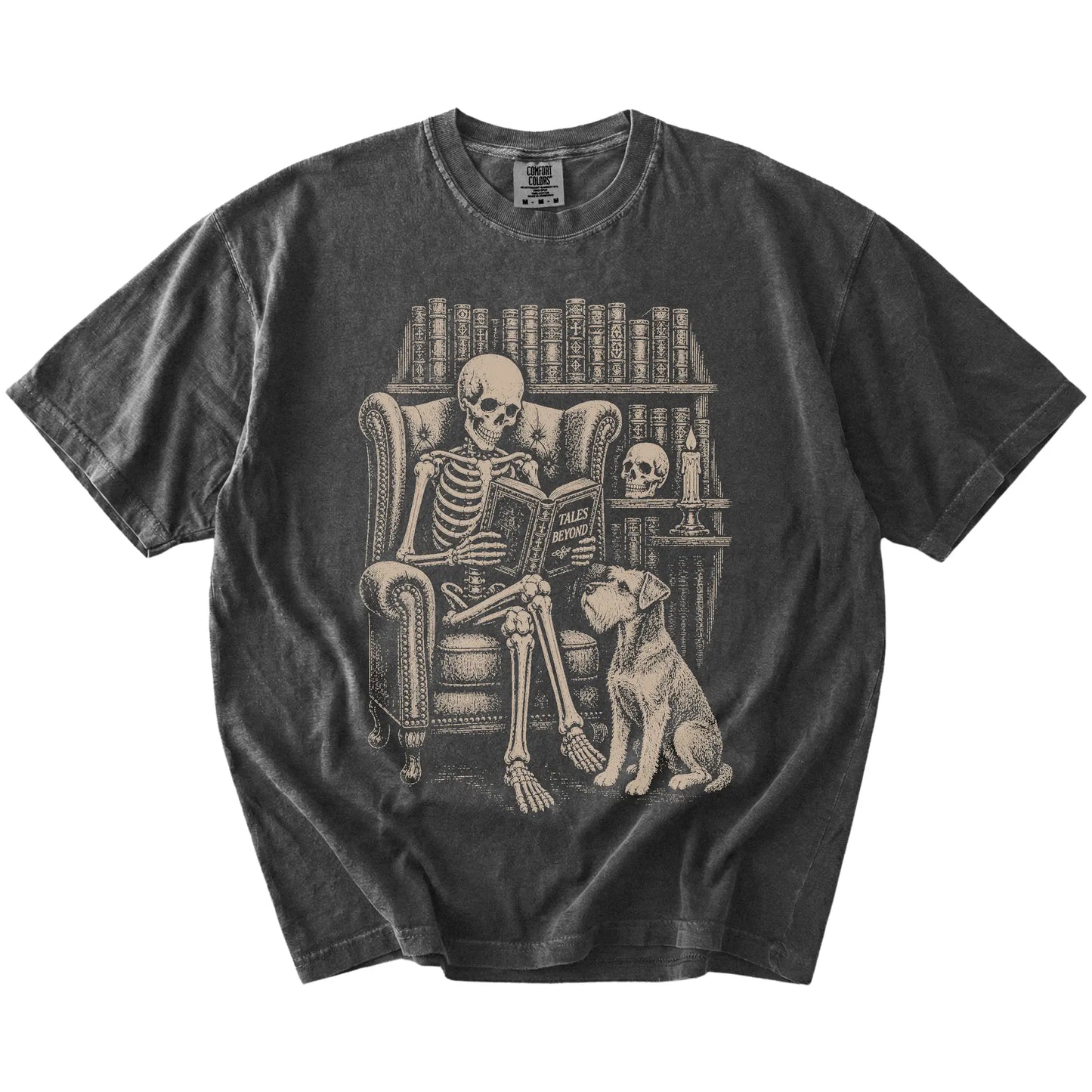 Skeleton reading in a library beside a Schnauzer on a Pepper Comfort Colors® T-shirt