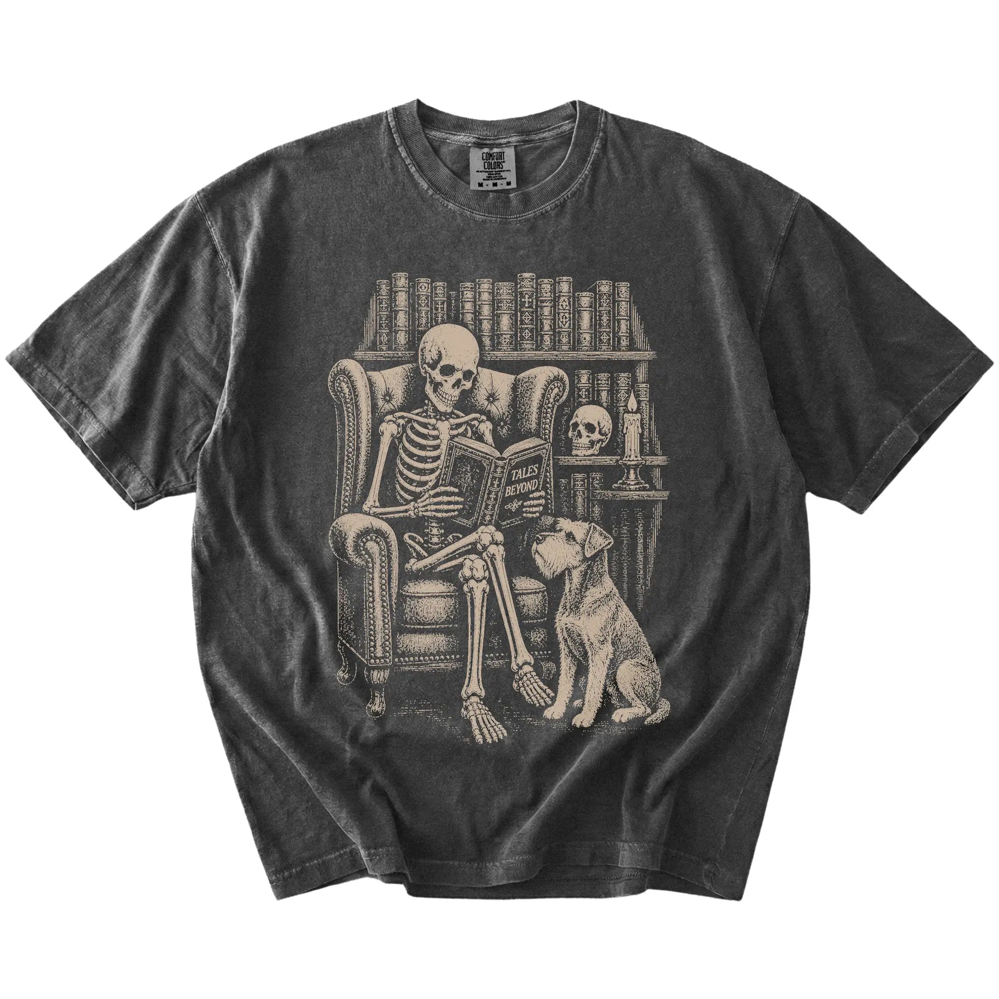Skeleton reading in a library beside a Schnauzer on a Pepper Comfort Colors® T-shirt