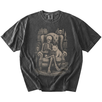 Skeleton reading in a library beside a Westie on a Pepper Comfort Colors® T-shirt