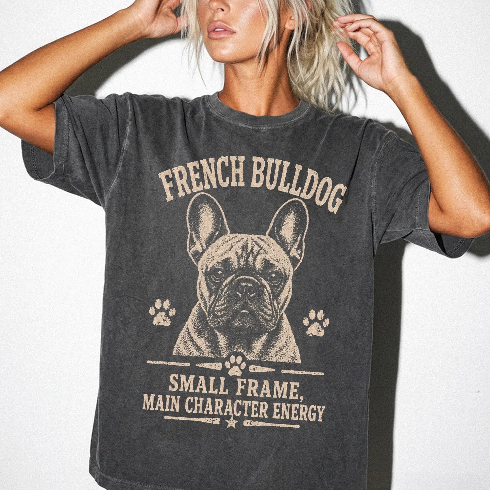 Model wearing a Pepper Comfort Colors® T-shirt featuring French Bulldog design with “Small Frame, Main Character Energy” lett