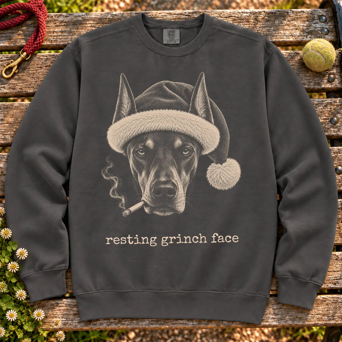 Doberman wearing a Santa hat and smoking on a Pepper sweatshirt